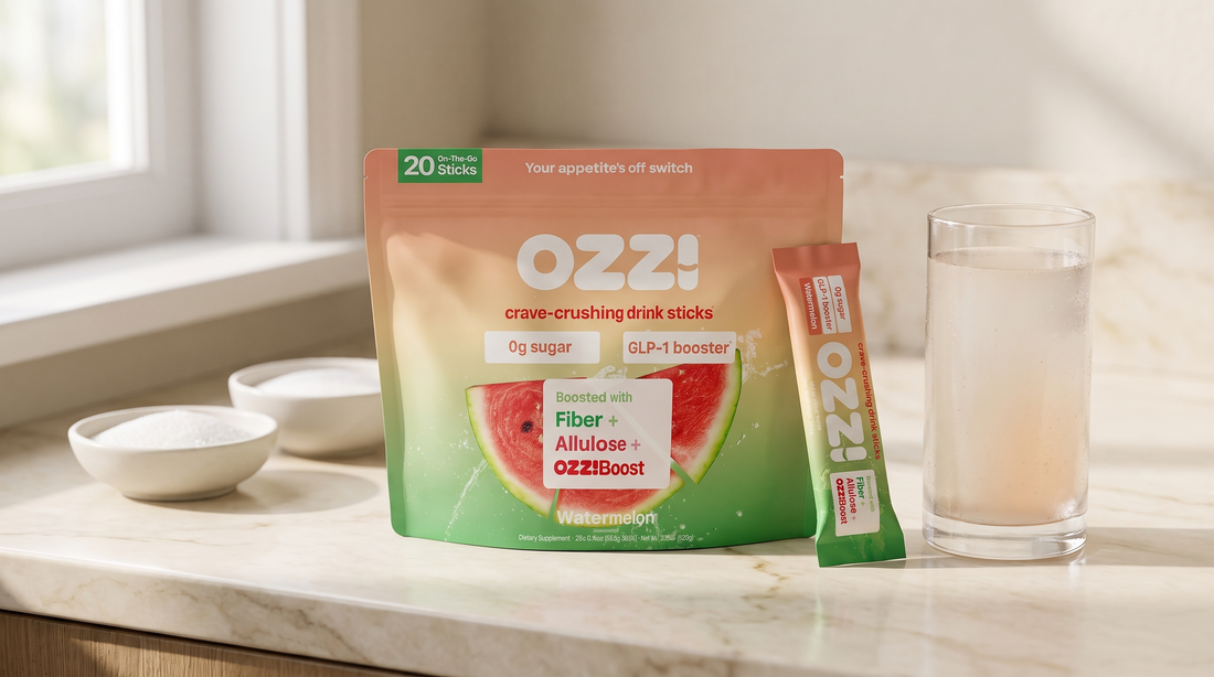 Ozzi watermelon drink stick pouch, a single stick, and a prepared glass on a kitchen counter beside two bowls of sweetener