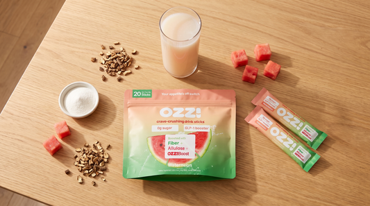 Overhead flatlay of the Ozzi watermelon pouch and two stick packs with chicory root, watermelon cubes, and a glass of the prepared drink