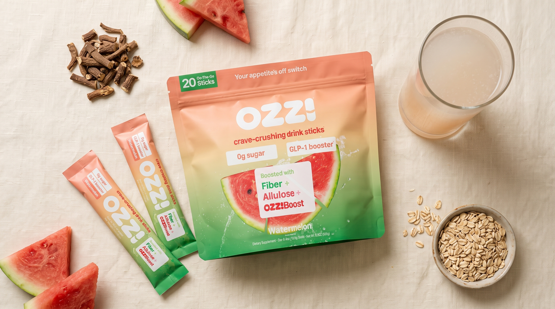 Overhead flat lay of the Ozzi watermelon pouch and stick packs with chicory root, watermelon, oats and a glass of prepared Ozzi