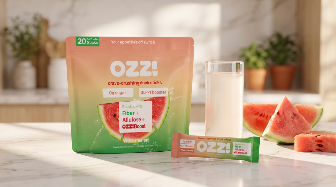 Ozzi watermelon drink stick pouch, single stick, and a glass of the prepared Ozzi drink on a kitchen counter in morning light